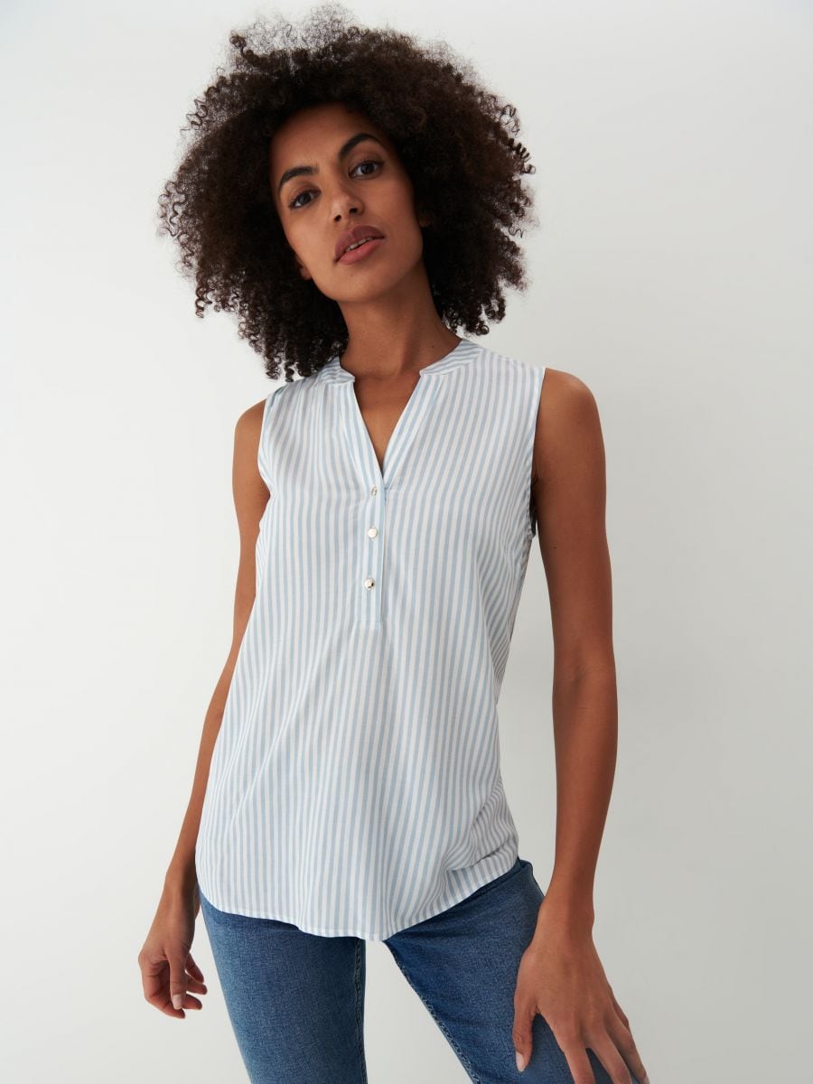 pale blue sleeveless blouse